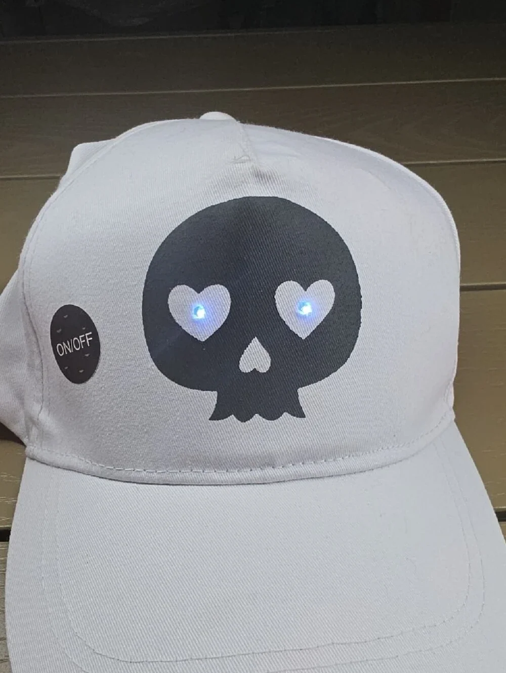 White Cap with Light Up Heart-Eye Skull Graphic